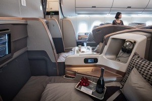 Passenger seats sit in the business class cabin of an Airbus SE A350 aircraft, operated by Singapore Airlines Ltd., ...