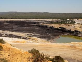 Julie Dingle beside the Alcoa open-cut coal mine and power station at Anglesea in Victoria.