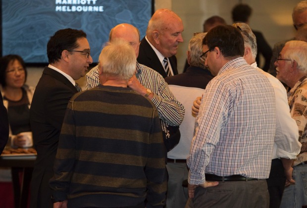 Slater & Gordon CEO Andrew Grech and Chairman John Skippen talk to investors after the company's AGM in Melbourne.