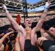 Top of the world: Jeff Horn points to the sky in celebration after being announced the winner.