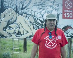 Dixon Terbasket at the first billboard raising on IR #2 (Lower Similkameen Indian Band) Photo credit: Zeus Helios