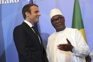 French President Emmanuel Macron speaks with Malian President Ibrahim Boubacar Keita during the opening session of G5 Shel force summit in Bamako, Mali, Sunday, July 2, 2017.