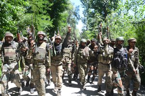 Indian army soldiers shout pro India slogans as they return from the scene of a gun fight at Dialgam in Anantnag some 60 kilometers south of Srinagar, the summer capital of Indian Kashmir, 01 July 2017. A top commander of the militant outfit Laskhar-e-Toiba (LeT) Bashir Lashkari and his associate were killed during the gunfight with security forces in Anantnag. Two civilians were also killed and several others injured as government forces allegedly opened fire at protesters during clashes near the scene of the clash.