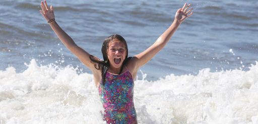 Abby Claps, 11, of Kings Park splashes around