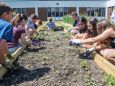 Sophia Waters tends to a vertical garden that