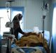 Sana Abdul Amir tends to her son, 18-year-old Abdulrahman Abdulaaly, at the Athba Field Hospital near Mosul, Iraq.