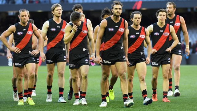 The Bombers make their way from the ground after the Round 15 AFL match between the Essendon Bombers and Brisbane Lions ...