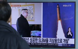 A man watches a TV news program showing photos published in North Korea's Rodong Sinmun newspaper of North Korea's "Pukguksong-2" missile launch and North Korean leader Kim Jong Un at Seoul Railway Station in Seoul, South Korea, Monday, Feb. 13, 2017.