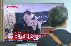 A man walks by a TV screen showing a news program reporting about North Korea's missile firing with an image of North Korean leader Kim Jong Un, at Seoul Train Station in Seoul, South Korea, Tuesday, July 4, 2017. North Korea on Tuesday claimed it successfully test-launched its first intercontinental ballistic missile, a potential game-changing development in what may be the world's most dangerous nuclear standoff and, if true, a direct rebuke to U.S. President Donald Trump's earlier declaration that such a test