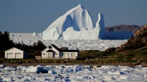 A giant iceberg passes Little Harbour  in Twillingate, Newfoundland and Labrador.