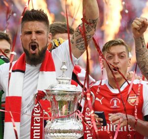 On fire: Arsenal players celebrate their FA Cup victory over Chelsea in May.