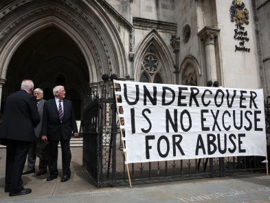 A banner protesting undercover policing outside the High Court