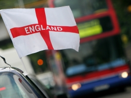 A flag of St George flying from a car ariel