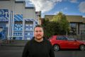 Brendan Brogan outside Howler, with the site of the proposed apartment block next door. 