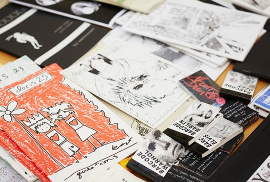 close-up of scattered zines and magazines