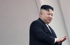 North Korean leader Kim Jong Un claps during a military parade on Saturday, April 15, 2017, in Pyongyang, North Korea to celebrate the 105th birth anniversary of Kim Il Sung, the country's late founder and grandfather of current ruler Kim Jong Un.