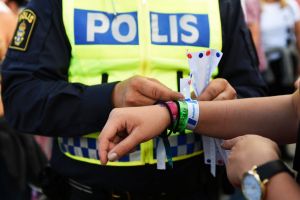 Continued issue with a police officer attaching a bracelet with the text #tafsainte, meaning don't grope, to a visitor's ...