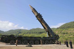 In this photo distributed by the North Korean government, North Korean leader Kim Jong Un, second from right, inspects the preparation of the launch of a Hwasong-14 intercontinental ballistic missile, ICBM, in North Korea's northwest Tuesday, July 4, 2017.