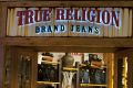 True Religion Apparel Inc. signage is displayed outside of a store at the Beverly Center mall in Los Angeles, ...