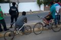 Bystanders look at bodies lying on a road in the town of Navolato, Sinaloa state, Mexico.  Mexican authorities said that ...