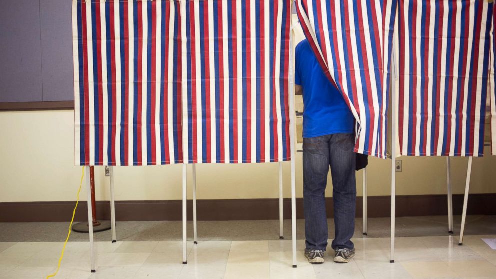 PHOTO: Voters fill out their ballots in the patriotic voting booths at Merrill Auditorium with a hour and 20 minutes to go before the polls close.