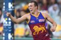 The Lions' Lewis Taylor celebrates one of his four goals.