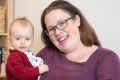 Erin Riley and her 9-month old daughter Abby at their rented home in Panania.