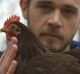 Brian Caraker believes in singing to his chickens.
