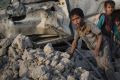 Iraqi children flee through the rubble as Iraqi forces continue their advance against Islamic State militants in the Old ...