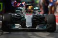 On top: Lewis Hamilton claims his sixth title in Montreal at the Canadian GP.