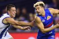 Jason Johannisen breaks clear of Nathan Hrovat.