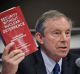 Former UK Naval commander Rob Green holds his book while discussing a new treaty to ban nuclear weapons on Wednesday.