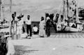 This undated photo discovered in the U.S. National Archives by Les Kinney shows people on a dock in Jaluit Atoll, ...