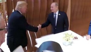 In this image taken from video U.S. President Donald Trump, left, shakes hand with the Russian President Vladimir Putin during the G20 summit in Hamburg Germany, Friday July 7, 2017.