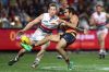 ADELAIDE, AUSTRALIA - JULY 07:  Eddie Betts of the Crows gets a kick away despite pressure from Dale Morris of the ...