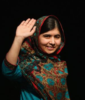 Malala Yousafzai waves to the crowd at a press conference at the Library of Birmingham after being announced as a ...