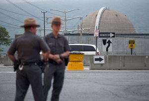 File - New York State Troopers stand at the main entrance of the Indian Point nuclear power plant Saturday May 9, 2015, after a transformer failed at New York's Indian Point 3 nuclear power plant, causing a fire that has been extinguished in Buchanan, N.Y.