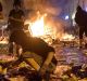 Protesters against the G20 Summit plunder a supermarket and throw the goods into fires in the Schanzenviertel district.