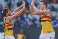 MELBOURNE, AUSTRALIA - JULY 01: Josh Jenkins of the Crows (R) celebrates a goal during the round 15 AFL match between ...