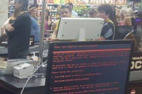 People stand around at a supermarket in the Ukraine unable to pay for their shopping due to Petya ransomware affecting ...