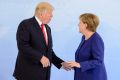 German Chancellor Angela Merkel receives US President Donald Trump in the Hotel Atlantic, on the eve of the G20 summit, ...