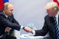 President Donald Trump and Russian President Vladimir Putin shake hands at the G20 summit.