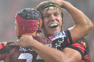 Hamish Stewart (left) of the Reds celebrates after scoring a try with teammate Adam Korczyk.