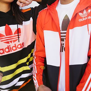 Image of man and woman wearing Adidas apparel.