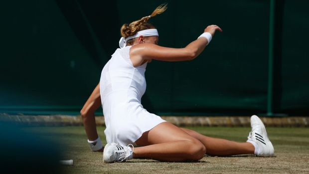 Kristina Mladenovic of France slips over during her match against Alison Riske at Wimbledon. Mladenovic was scathing of ...