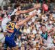 On the bounce: Port ruckman Paddy Ryder contests the tap with Scott Lycett.