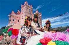 Girls in traditional costume on a float at the Rose Festival, Morocco.