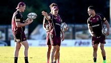 BRISBANE, AUSTRALIA - JULY 04: Ben Hunt, Coen Hess and Valentine Holmes talk tactics during a Queensland Maroons State ...