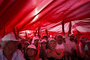 Supporters of Kemal Kilicdaroglu, the leader of Turkey's main opposition Republican People's Party, hold a huge Turkish flag as they gather for a rally following their 425-kilometer (265-mile) 'March for Justice' in Istanbul, Sunday, July 9, 2017.