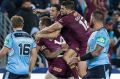 Touch and go: Dane Gagai celebrates after receiving the no-look pass from Michael Morgan in Origin II, a play he ...